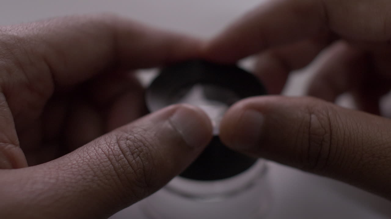 Thumbs Tapping On Loupe Magnifier