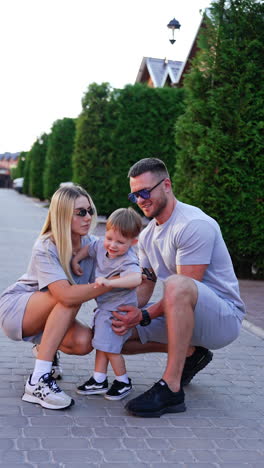 happy family enjoying a summer evening. family joyfully interacts outside in a beautiful setting, highlighting love and connection between parents and child