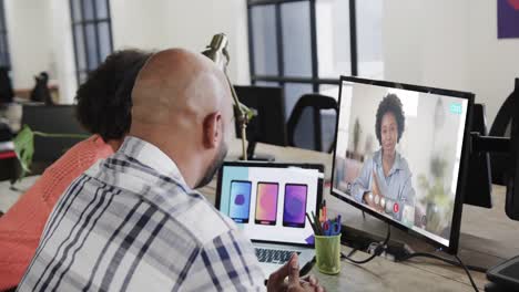 African-american-business-people-on-video-call-with-african-american-female-colleague-on-screen