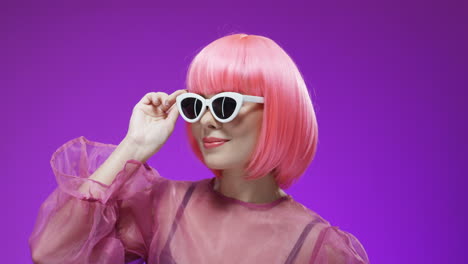 portrait of pretty woman wearing a pink wig