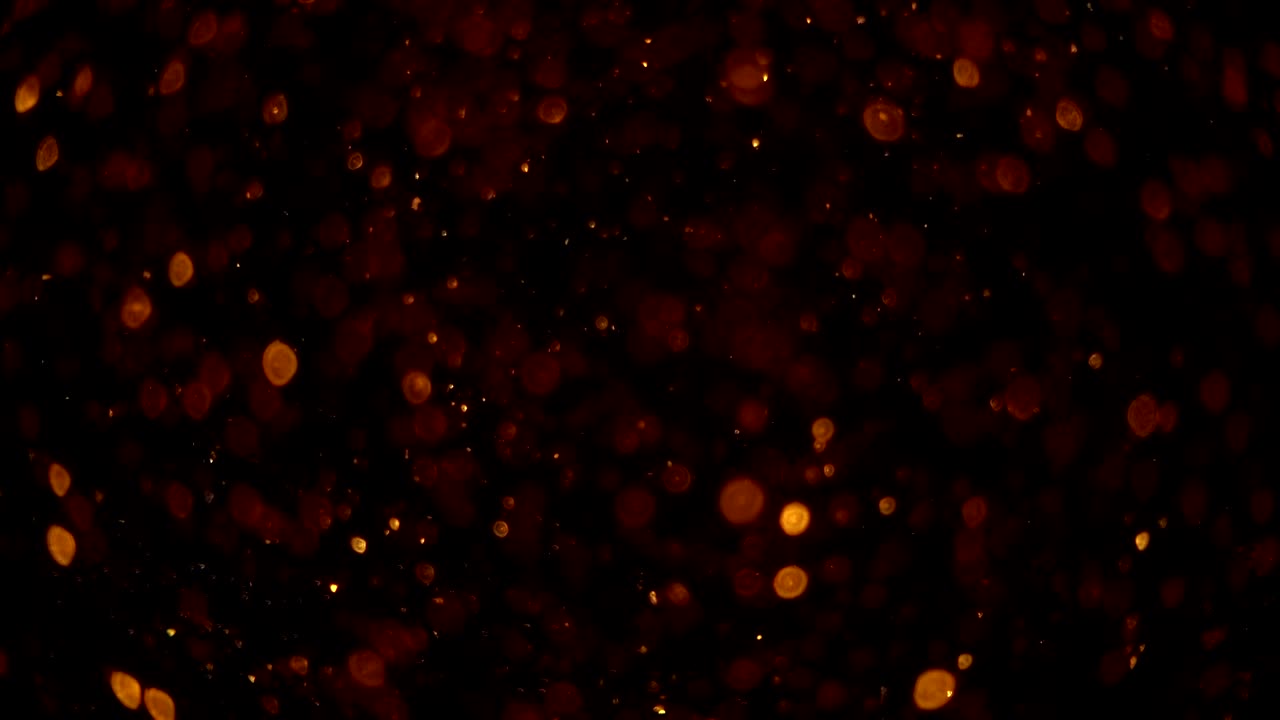 partículas bokeh doradas abstractas. fondo con chispas de bokeh brillantes. animación suave en bucle. con un lugar central para el texto de su logotipo.