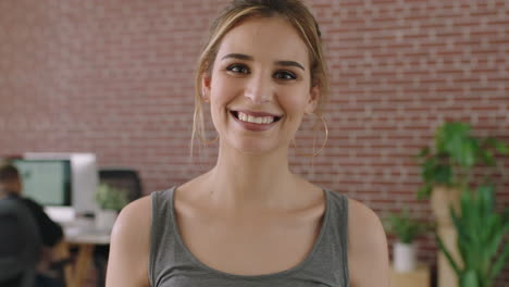 portrait-of-beautiful-young-woman-in-contemporary-office-laughing-cheerful-enjoying-start-up-business-opportunity