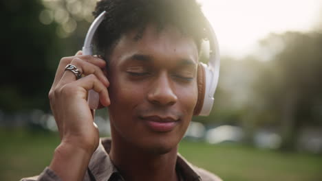 man listening to music with headphones