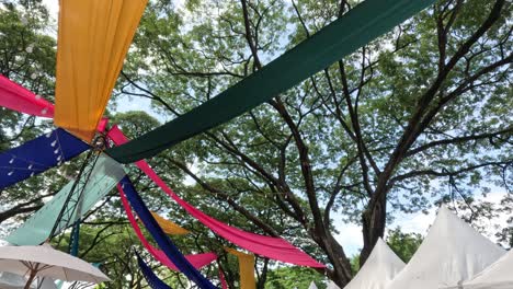 festive decorations under a canopy of trees