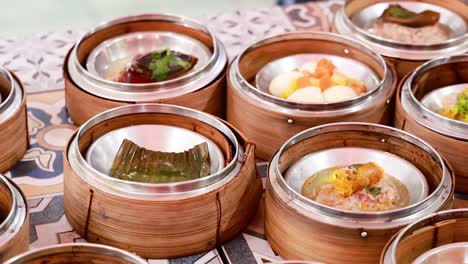 assorted dim sum dishes in steamed baskets