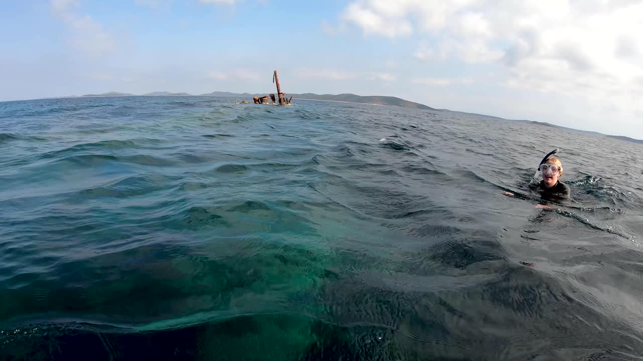 Women snorkeling near sunken ship Michelle, Dugi Otok, Croatia,