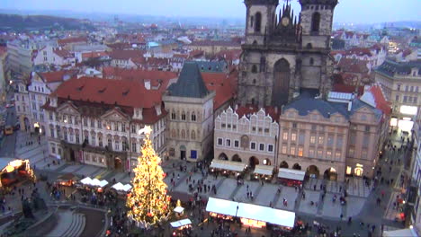 prague, czech republic christmas markets aerial view from belltower of musical christmas tree in front of the iconic church old lady before tyn