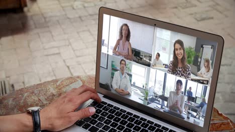 Man-having-a-video-conference-with-many-people