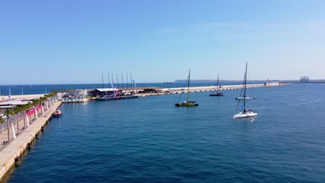 Sailboats-Adrift-On-Mediterranean-Sea-Near-Port-Of-Alicante-In-Spain-On-A-Sunny-Day