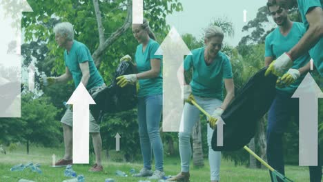 Animation-of-flying-arrows-over-happy-diverse-group-cleaning-up-rubbish-in-countryside