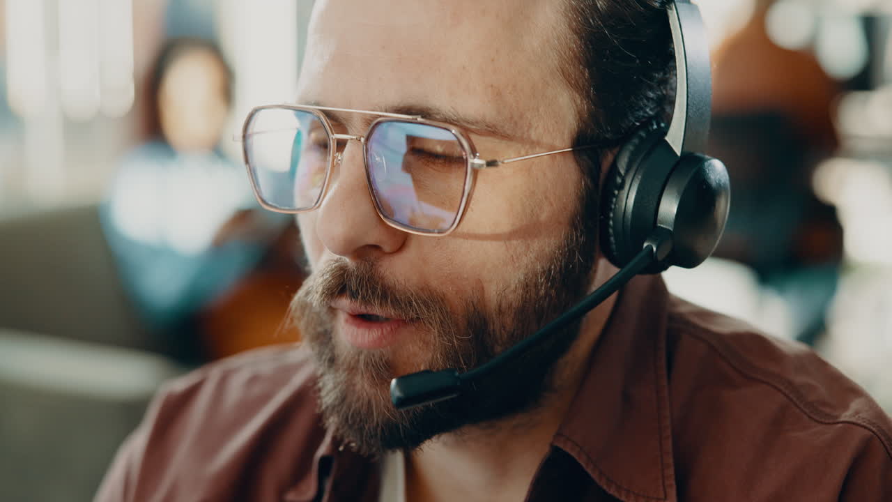 Man wearing headset in call center