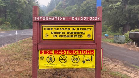 Fire-Hazard-Sign-At-Natural-Park-In-Oregon,-Prohibiting-Burning-Of-Debris-During-Fire-Season