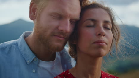 love couple enjoy summer holiday. closeup sexy marriage close eyes in mountains