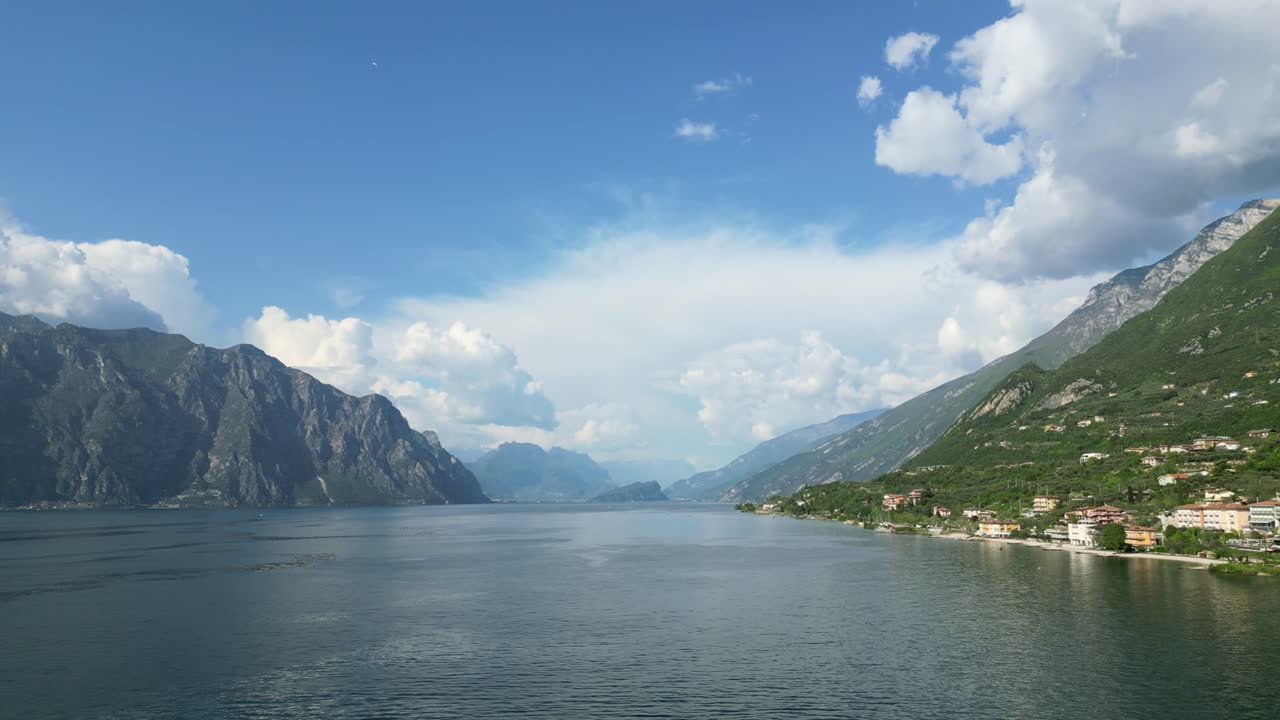Aerial footage of Lake Garda near Malcesine, Verona, Italy. Shot with a drone, this video showcases the natural scenery, mountains, and lakeside views of this iconic Italian destination