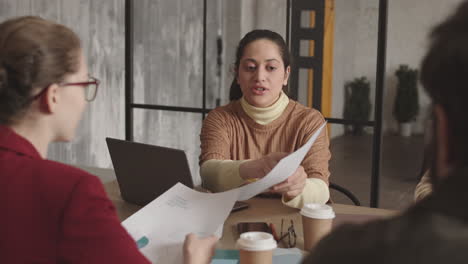 Colleagues Discussing Business Papers