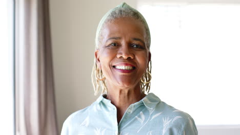 african american senior woman standing indoors, smiling at camera