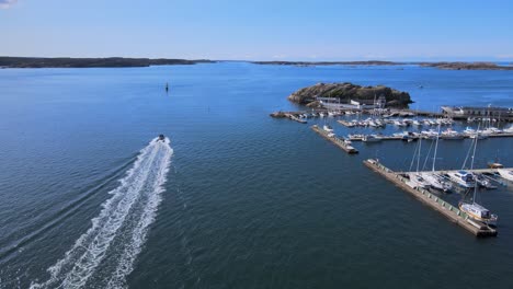 boat wake -backwash from a motorboat cruising in the ocean near marina in lysekil, sweden