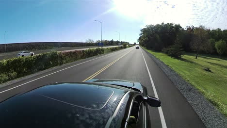 Driving-a-black-car-on-road-in-St