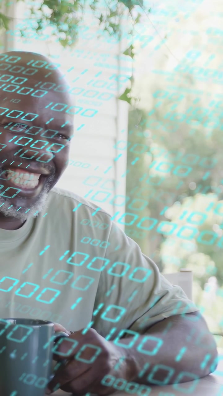 Vertical video: Senior man holding mug, turning to off-mic laugh, tech binary drifting across face