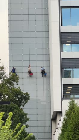 window cleaning crew on high-rise building