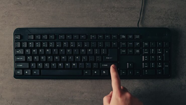 Person Typing on a Keyboard