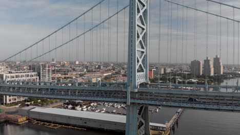 Sunrise-aerial-drone-footage-of-Benjamin-Franklin-Bridge-in-Philadelphia