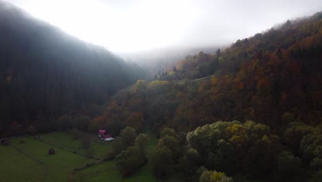 Scenic-misty-sunrise-during-early-Autumn,-aerial-cinematic-view