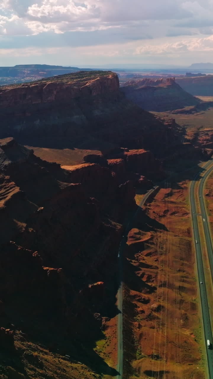 Sunlit cliffs and rocks of Zion National park at daytime. Amazing scenery of deserted territory from top view. Vertical video