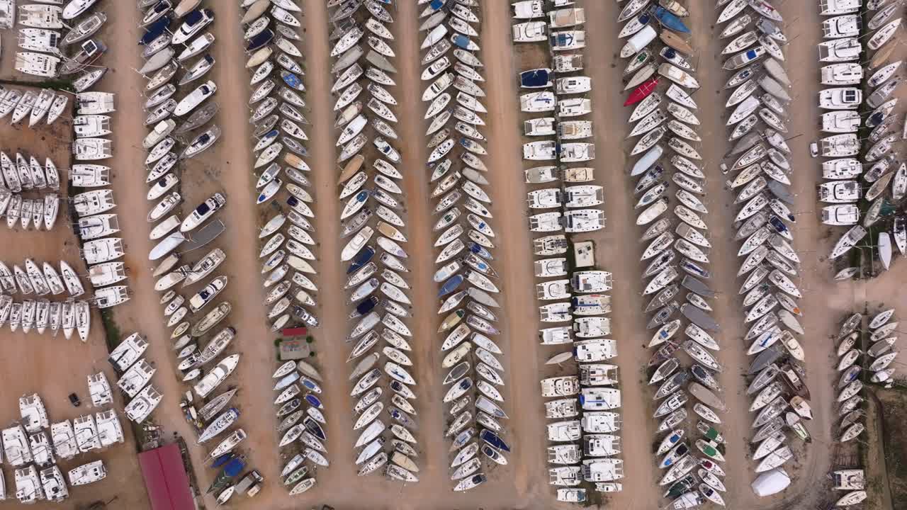 Rows of boats stored for winter at quiet marina Greece