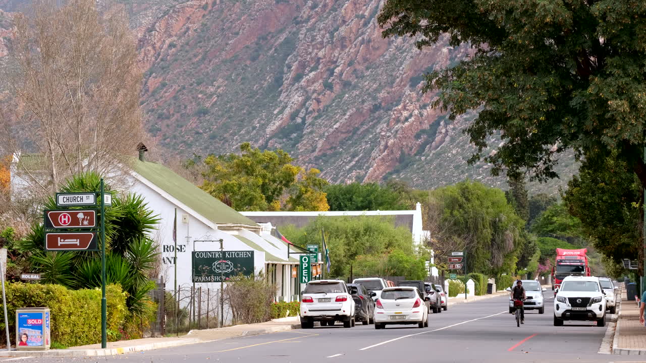 Cars drive down main road of quaint Montagu town in Little Karoo on Route 62