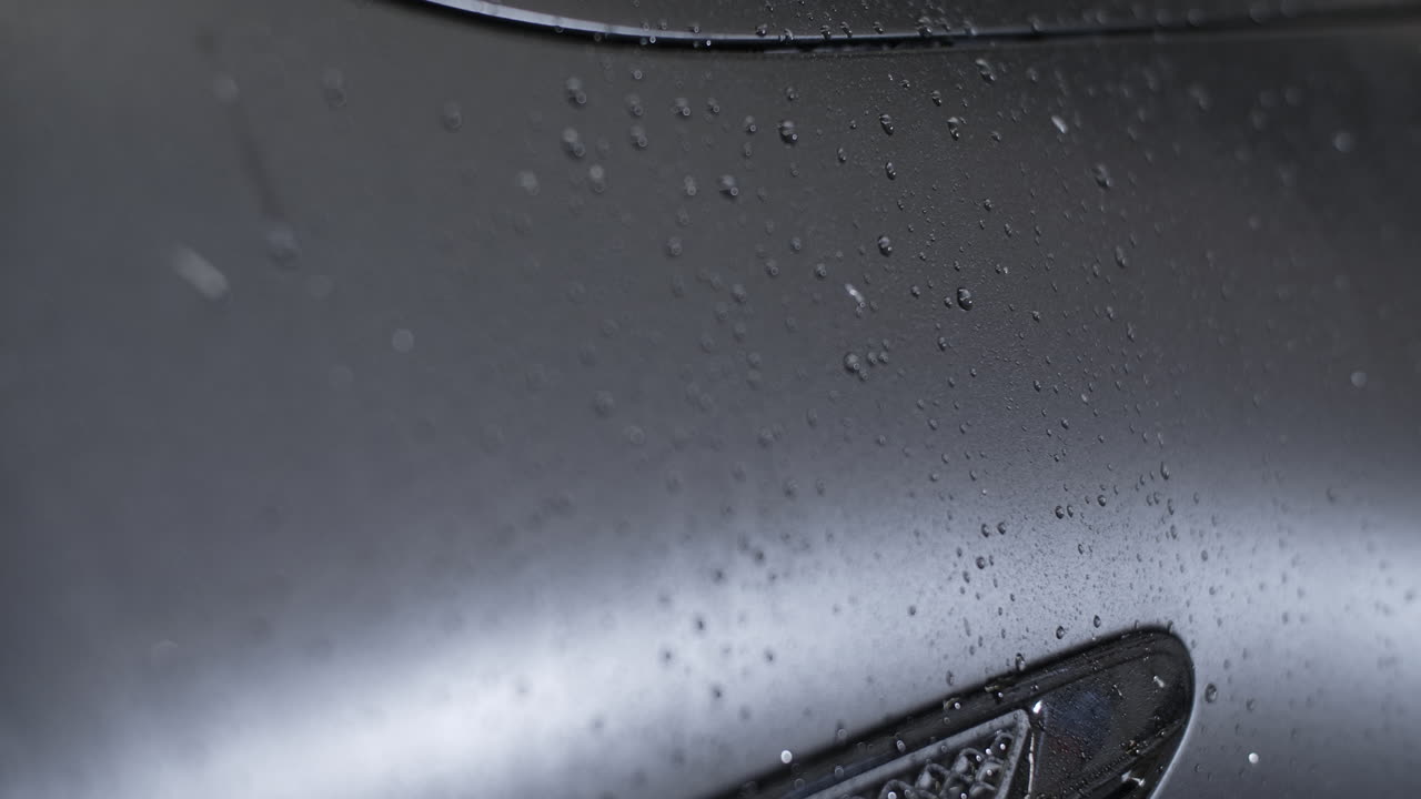 Water Drops on a Dark Gray Car