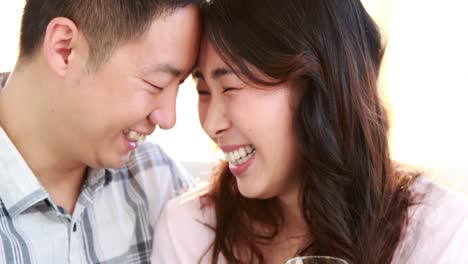 happy couple holding flutes of champagne