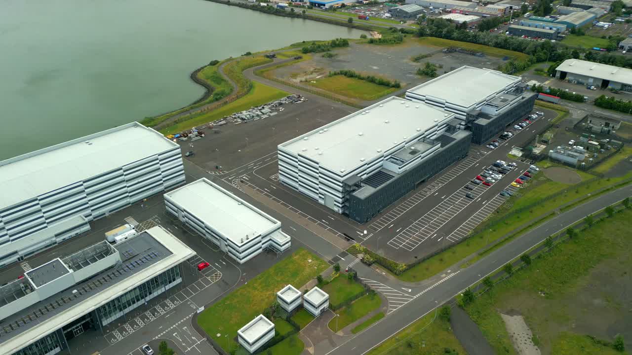 Reversing overhead aerial video GV of Studio Ulster, a virtual production film studio in Belfast, Northern Ireland, UK. Filmed in 60FPS, 4K and with Rec709 color