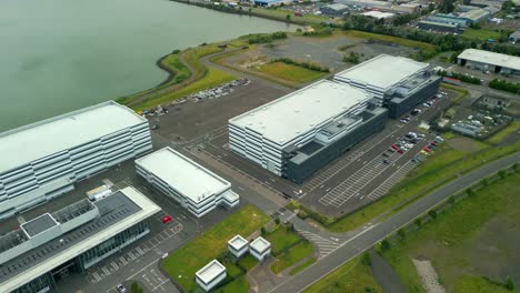 reversing overhead aerial video gv of studio ulster, a virtual production film studio in belfast, northern ireland, uk. filmed in 60fps, 4k and with rec709 color