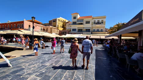 people walking and exploring charming coastal town streets on sunny day