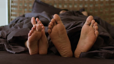 bare feets on bed