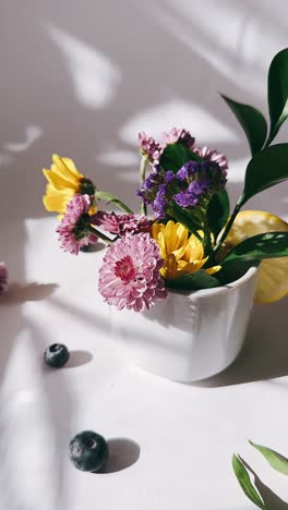 floral arrangement in white bowl