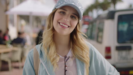 portrait of attractive blonde woman smiling happy enjoying vacation