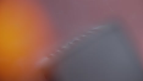 Close-Up of Matchstick Rubbing Against Red Strike Strip