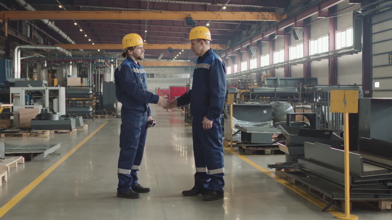Supervisors Shaking Hands At Plant Facility