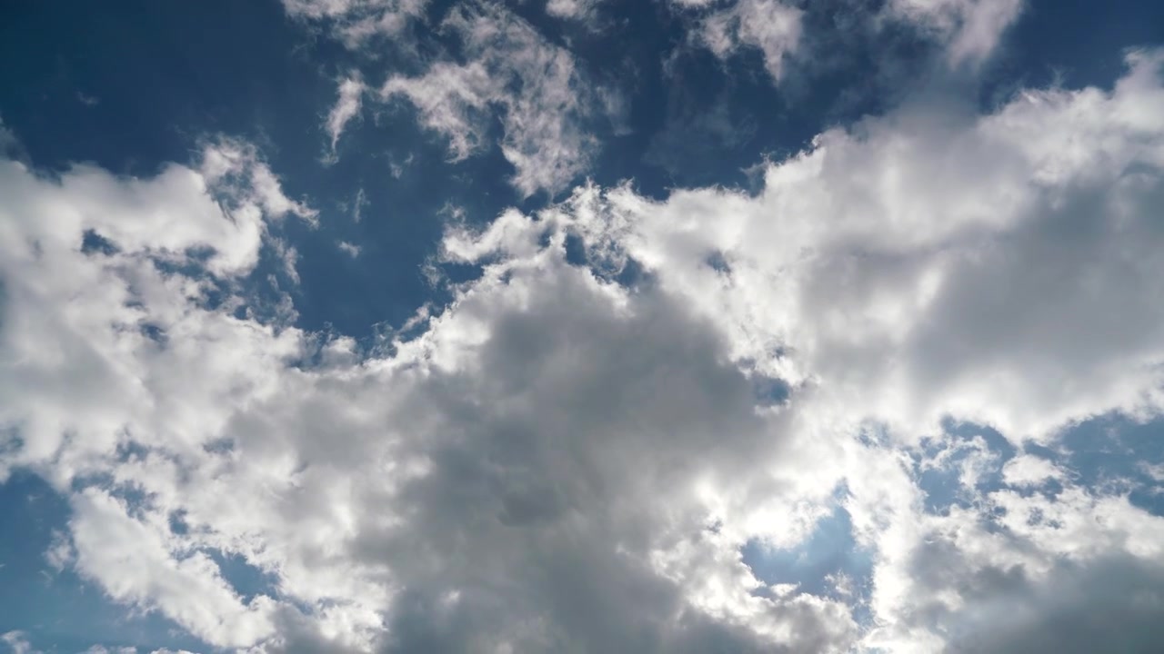 Time Lapse of White Clouds Moving Across a Blue Sky