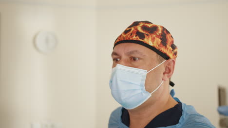 doctor in surgical scrubs and mask