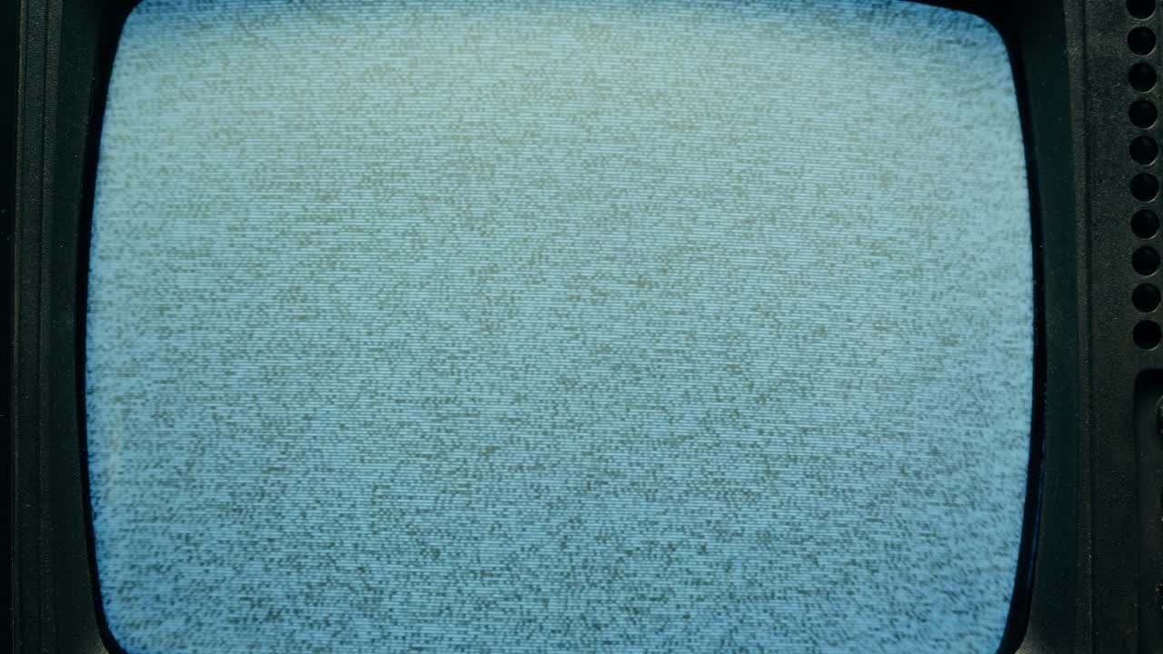 Retro Style TV Set with Green Screen chroma key background, vintage 60s analog television with grain and noise.