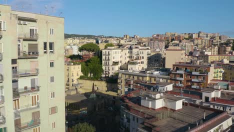 drone flies close to colourful apartment buildings in napoli, italian capital of campania