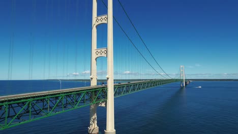 the mackinac bridge stretches five miles across the straits of mackinac to connect mackinaw city and st