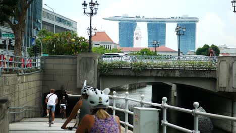singapore cityscape with marina bay sands and river bridge