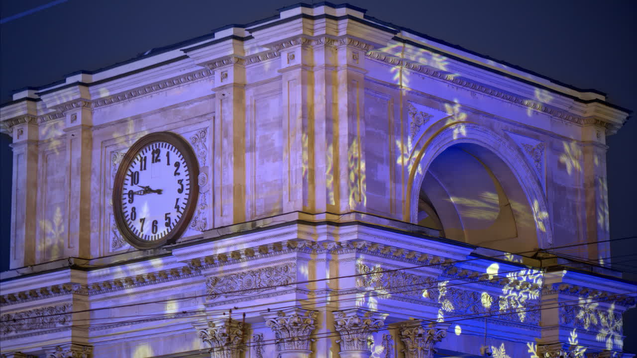 Snowflakes projection on the Triumphal Arch in the evening, Chisinau, Moldova