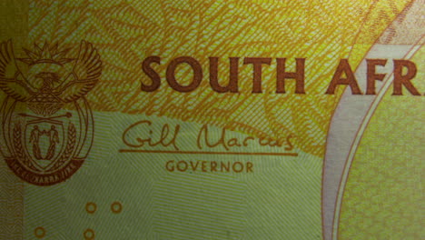 this is the macro view of a normal paper banknote- money- currency of 200 south african rand