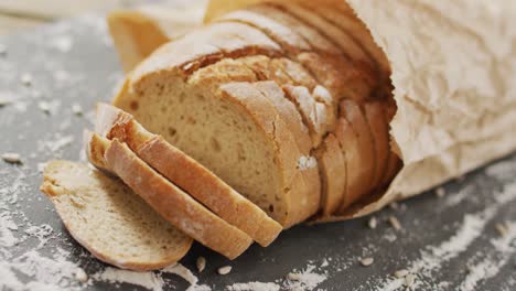 Video-of-bread-in-paper-bag-on-baking-paper-on-wooden-worktop