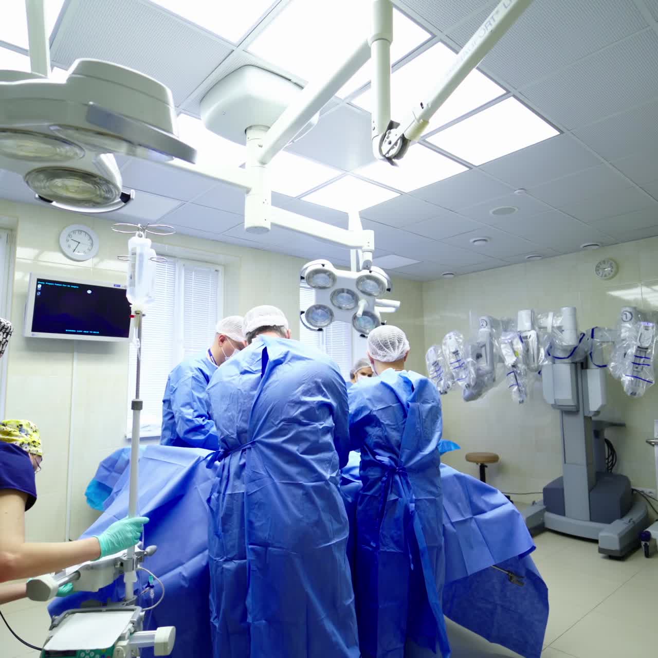 Medical robot arm of future. Automation robot hand machine in operating room and surgery doctors in futuristic hospital